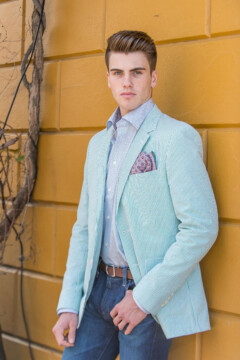 Southern Gent - Mint green Haspel seersucker jacket, pink print pocket square, blue print shirt, slim-skinny dark blue washed jeans, all from Rubenstein’s.