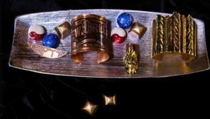 Sugar & Spice: Copper Necklace with patina etched New Orleans Bayou St. John pendant and Copper Cuff with patina etched of New Orleans Historical both provided by Designer Brandi Couvillion; Gold plated arrow ring and cuff provided by Designer Reagan Charleston