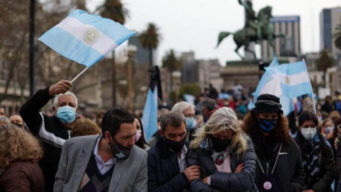 Argentines demonstrate in Buenos Aires on Aug. 16. In the so-called “March of the Stones,” they remembered the more than 110,000 COVID-19 deaths in the country at the time, with a stone as a symbol of each victim. In the Sept. 12 primaries, they will be able to express their discontent or support for the government and its handling of the pandemic and other issues. (Tomas Cuesta/Getty Images)