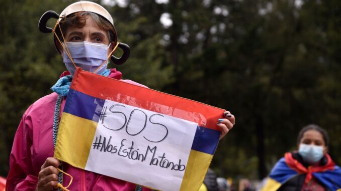 Colombians demonstrate against the government on July 29. Protests against poverty, inequality and police brutality broke out in April. With a polarized society, Colombia will hold a presidential election in May 2022. (Guillermo Legaria/Getty Images)