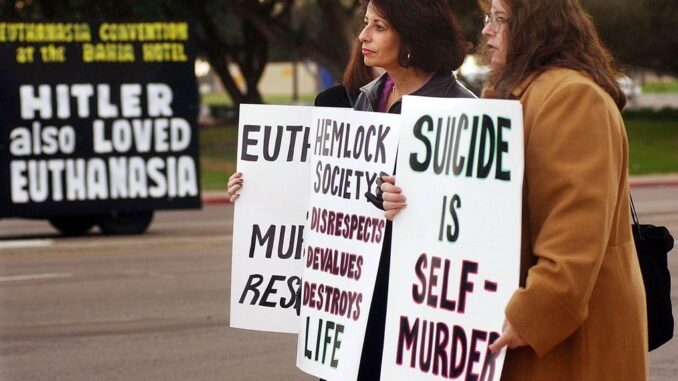 Members of the California Right to Life Coalition demonstrate in opposition of euthanasia, in 2003, in San Diego, California. (Sandy Huffaker/Getty Images)